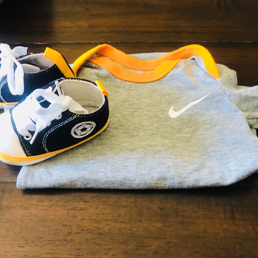 Nike yellow onsies and soccer shoes included 0-3mo